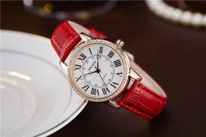Red leather strap quartz watch for women with diamond bezel and Roman numeral white dial.