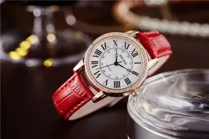 Elegant XINKON women quartz watch with red leather strap and sparkling diamond bezel detail.
