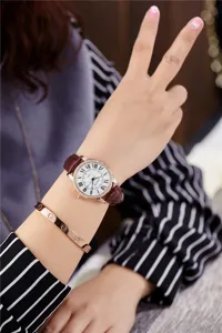 Women quartz watch with brown leather strap, white Roman numeral dial and sparkling diamond bezel.
