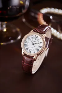 Women's quartz watch with brown leather strap, rose gold diamond bezel and Roman numerals.