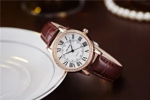 Women quartz watch with brown leather strap, white Roman dial and rhinestone bezel.