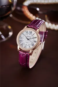 Elegant women's quartz watch with purple leather strap, rose gold diamond bezel and Roman numerals.