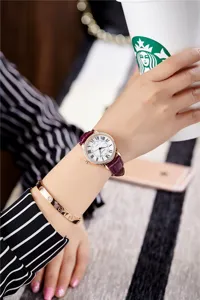 Elegant women's quartz watch with purple leather strap, Roman numerals and rhinestone bezel.