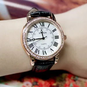 Women rhinestone quartz watch with Roman numerals and black leather strap for daily wear.