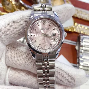 Close-up detail of the pink dial quartz watch with stainless steel jubilee bracelet.