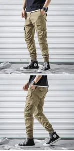Men khaki cargo pants detail view showing multi pockets, elastic cuffed hem, and casual fit.