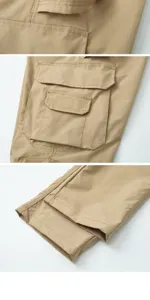 Men's casual cargo pants detail shot showing multi-pockets and durable stitching design.