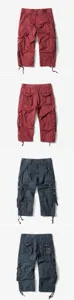 Detailed view of men's multi-pocket cargo cropped shorts, loose fit, adjustable cuffs.
