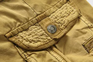 Men cargo shorts detail close up khaki tactical workwear multi pocket shorts pant