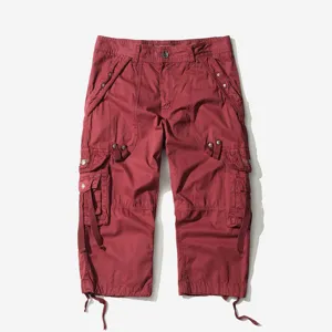 Men's loose cargo capri shorts in burgundy color featuring multiple functional pockets.