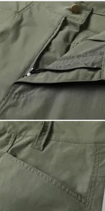 Men cargo pants detail shot, military green fabric, zipper fly and metal button close-up.