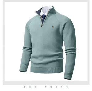 Close-up detail view of men's half-zip ribbed knit sweater collar and zipper texture.