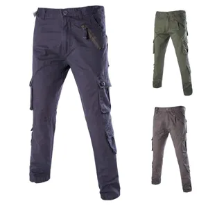 Detailed view of mens loose cargo trousers featuring multiple utility pockets and zip accents.