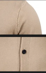 Detail view of men's knitwear shoulder and button craftsmanship in khaki, fine knit fabric.