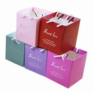 Colorful square paper gift bags with handles for wedding favors, small and cute design.