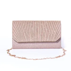 Detailed view of the sparkling pleated evening bag showcasing exquisite glitter texture.