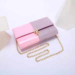 Pink glitter evening clutch bag with gold chain strap for women wedding party detail.
