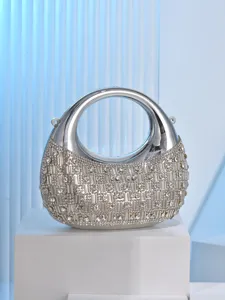 Detailed view of a stunning silver rhinestone crescent evening bag with acrylic hard shell.