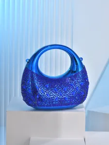 Close-up detail of the stunning blue metallic rhinestone evening bag with sparkling gems.