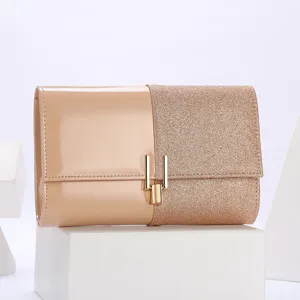 Elegant women's evening clutch bag with chic split design, sparkly glitter and glossy patent leather.