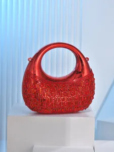 Red crescent acrylic rhinestone evening bag detail, sparkling crystal clutch for banquet events.