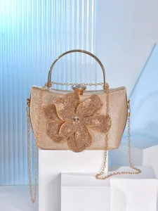 Detailed view of the luxury rhinestone rose evening clutch bag with gold chain and handle.