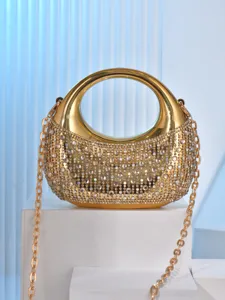 Gold crescent acrylic evening clutch bag with sparkling rhinestones and chain strap.