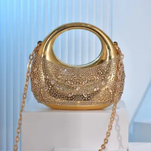 Mini metallic rhinestone evening bag with round handle and chain strap for party and banquet.