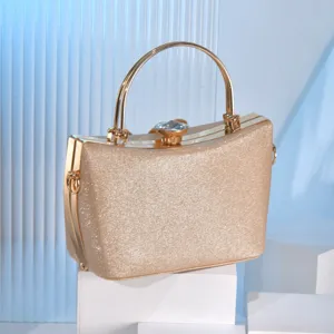 Gold glitter evening clutch bag for women with metal handle and crystal clasp main view