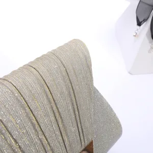 Detailed view of a glittering pleated evening clutch bag, featuring metallic sparkle fabric.