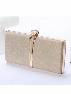 Sparkly evening clutch bag with metallic frame and rhinestone clasp for formal party wear.