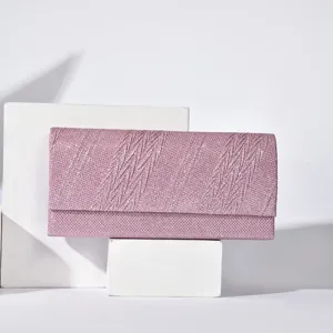 Detailed view of pink glitter evening clutch bag showcasing delicate textured surface fabric.