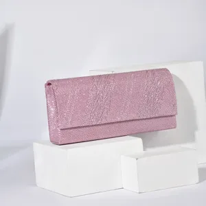 Pink glitter evening clutch bag detail view, elegant women's party handbag and purse.