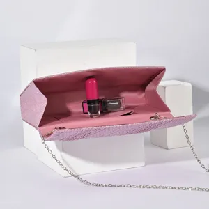 Pink glitter clutch bag for women, elegant evening crossbody purse with silver chain strap.