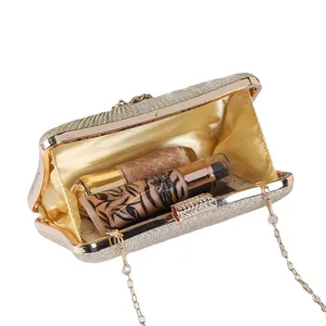 Elegant gold glitter evening clutch bag with rhinestone clasp and chain strap for party.
