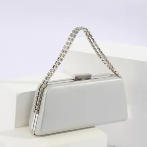 Silver evening clutch bag with sparkling rhinestone chain strap for party banquet events.