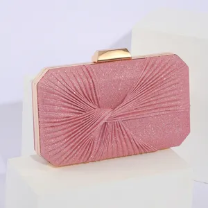 Pink glitter evening clutch bag for women, elegant pleated hard case handbag with gold hardware.
