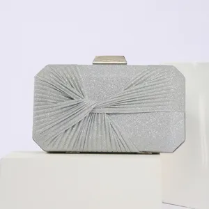 Silver glitter pleated evening clutch bag, elegant metallic clasp design for women parties.