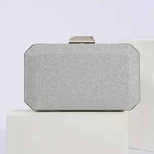 Silver glitter evening clutch bag for women, elegant hard case bridal handbag detail.