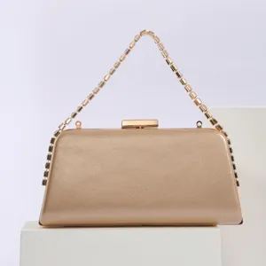 Elegant gold evening clutch bag with rhinestone chain strap, premium PU leather texture.