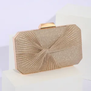 Gold glitter pleated evening clutch bag with metal clasp for women banquets and parties.