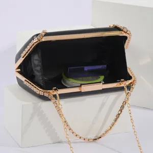Elegant black PU leather evening clutch with rhinestone gold metal frame and chain strap.