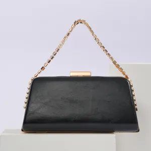 Black PU leather evening clutch bag with rhinestone chain handle and metal lock for women.