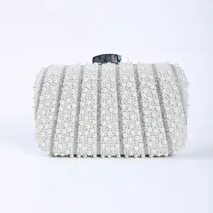 Pearl rhinestone evening clutch bag detail view, elegant beaded wedding bridal handbag.