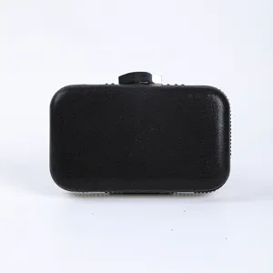 Elegant black evening clutch bag featuring metallic clasp and sparkling crystal side trim.