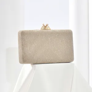 Elegant champagne glitter evening clutch bag with diamond clasp detail for women events.