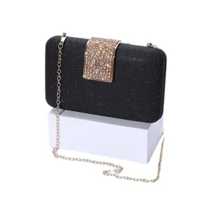 Elegant black glitter clutch bag with sparkling rhinestone clasp and gold chain strap for women.