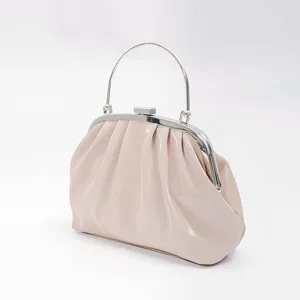 Detailed view of the elegant pink ruched clutch bag with silver frame and metal top handle.