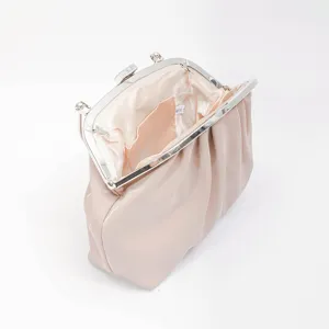 Elegant pleated cloud clutch bag with kiss-lock closure, stylish women handbag for evening.