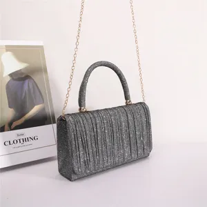 Sparkling pleated top handle shoulder bag for women, stylish crossbody evening bag with chain.